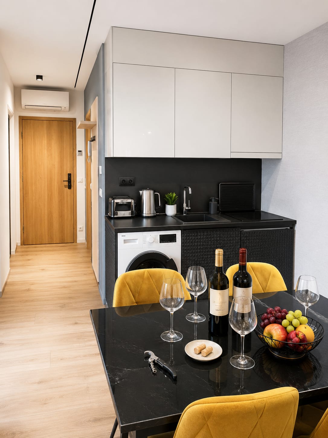 Kitchen counter, washer, and dining table